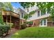 Spacious backyard featuring a wood deck, brick elevation and lush green lawn at 15 Vickwood Court Ne, Marietta, GA 30068