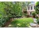 Scenic backyard view with lush landscaping and a charming deck at 15 Vickwood Court Ne, Marietta, GA 30068