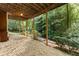 Covered patio overlooking a private, wooded backyard at 15 Vickwood Court Ne, Marietta, GA 30068