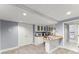 Basement kitchenette with white cabinetry, appliances, and a breakfast bar at 15 Vickwood Court Ne, Marietta, GA 30068