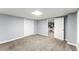 Finished basement area with gray walls, neutral carpet and access to the kitchen at 15 Vickwood Court Ne, Marietta, GA 30068