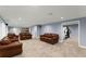 Finished basement space with multiple seating areas and a fitness area at 15 Vickwood Court Ne, Marietta, GA 30068