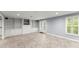Large basement area with built-in shelving and a walkout to the back yard at 15 Vickwood Court Ne, Marietta, GA 30068