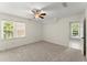 Well-lit bedroom with large windows, plush carpet, and an adjoining sitting area at 15 Vickwood Court Ne, Marietta, GA 30068