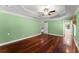Large bedroom with hardwood floors, tray ceiling, and neutral color paint at 15 Vickwood Court Ne, Marietta, GA 30068