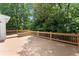 Spacious wooden deck with railings and a view of the surrounding trees at 15 Vickwood Court Ne, Marietta, GA 30068