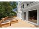 Wooden deck featuring planter boxes and white siding with a view of the surrounding trees at 15 Vickwood Court Ne, Marietta, GA 30068