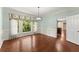 Elegant dining room featuring wainscoting, hardwood floors, and a modern chandelier at 15 Vickwood Court Ne, Marietta, GA 30068