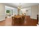 Open dining area with a large table, views into the living room, and brick accent walls at 15 Vickwood Court Ne, Marietta, GA 30068
