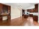 Open dining area with hardwood floors, seamless access to the sunroom, and brick accent walls at 15 Vickwood Court Ne, Marietta, GA 30068