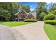 Beautiful two-story brick home with well-maintained lawn and long driveway at 15 Vickwood Court Ne, Marietta, GA 30068