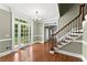 Elegant foyer with hardwood floors, grand staircase, and French doors at 15 Vickwood Court Ne, Marietta, GA 30068