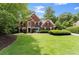 Manicured front lawn with mature trees and meticulous landscaping at 15 Vickwood Court Ne, Marietta, GA 30068