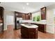 Beautiful kitchen with an island, granite countertops, stainless fridge, and ample cabinet space at 15 Vickwood Court Ne, Marietta, GA 30068