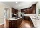 Gourmet kitchen with granite counters, dark wood cabinets, and stainless steel appliances at 15 Vickwood Court Ne, Marietta, GA 30068