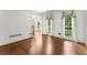 Bright living room with hardwood floors and large windows providing natural light at 15 Vickwood Court Ne, Marietta, GA 30068