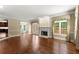 Spacious living room with hardwood floors, fireplace, and access to the outdoor deck at 15 Vickwood Court Ne, Marietta, GA 30068