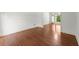 Spacious room with hardwood floors and open doorway leading to dining area at 15 Vickwood Court Ne, Marietta, GA 30068