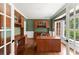 Spacious home office with custom built-ins, hardwood floors, and ample natural light at 15 Vickwood Court Ne, Marietta, GA 30068