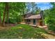 Spacious backyard with lawn and mature trees, showcasing the home's exterior at 2775 Doaks Run Ct, Tucker, GA 30084