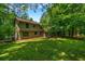 Spacious backyard with lawn and mature trees, showcasing the home's exterior at 2775 Doaks Run Ct, Tucker, GA 30084