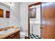 Well-maintained bathroom with vanity, classic tile, and convenient in-unit laundry area at 2775 Doaks Run Ct, Tucker, GA 30084