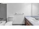 Bathroom with a tub and shower combination, single sink vanity with wood cabinets and silver hardware at 2775 Doaks Run Ct, Tucker, GA 30084