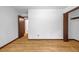 Bedroom featuring hardwood floors, closet, neutral paint, and ensuite access at 2775 Doaks Run Ct, Tucker, GA 30084