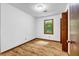 Cozy bedroom with wood floors, a window, and neutral paint at 2775 Doaks Run Ct, Tucker, GA 30084