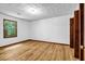 Bedroom features hardwood floors, neutral paint, closet, and window at 2775 Doaks Run Ct, Tucker, GA 30084