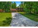 Charming home with a brick facade, two-car garage, well-manicured lawn, and mature trees at 2775 Doaks Run Ct, Tucker, GA 30084