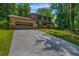 Charming home with a brick facade, two-car garage, well-manicured lawn, and mature trees at 2775 Doaks Run Ct, Tucker, GA 30084