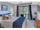 Comfortable bedroom featuring a sliding glass door that exits to a relaxing patio at 4604 Vinings Central Se Run # 131, Atlanta, GA 30339