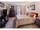 Well-lit bedroom featuring carpet, neutral walls, and plenty of dresser and desk space at 4604 Vinings Central Se Run # 131, Atlanta, GA 30339