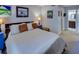Bedroom showcasing neutral walls, carpet, a large window, and an ensuite bath at 4604 Vinings Central Se Run # 131, Atlanta, GA 30339