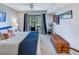 Cozy bedroom features neutral walls, carpet, and a sliding glass door to a private patio at 4604 Vinings Central Se Run # 131, Atlanta, GA 30339