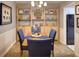 Cozy dining room with seating for four, complemented by a built-in display and convenient access to the kitchen at 4604 Vinings Central Se Run # 131, Atlanta, GA 30339