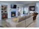 Bright living room with a cozy fireplace, built-in shelving, and a comfortable sofa, perfect for relaxing evenings at 4604 Vinings Central Se Run # 131, Atlanta, GA 30339