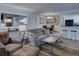 Stylish living room with a large sectional sofa, decorative rug, and a breakfast bar offering an open living concept at 4604 Vinings Central Se Run # 131, Atlanta, GA 30339