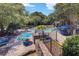 Community pool area with lounge chairs, tables, umbrellas, and lush green landscaping at 4604 Vinings Central Se Run # 131, Atlanta, GA 30339