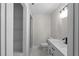 Modern bathroom featuring sleek vanity and updated fixtures at 772 Brookwood Sw Ter, Lilburn, GA 30047