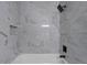This bathroom has a shower with marble-like tile and modern fixtures, offering a spa-like experience at 772 Brookwood Sw Ter, Lilburn, GA 30047