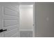 View of bedroom through open door, featuring neutral colors and new carpet at 772 Brookwood Sw Ter, Lilburn, GA 30047