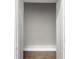 View of walk-in closet with hardwood floors at 772 Brookwood Sw Ter, Lilburn, GA 30047