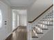 View of the front entry showing the door and staircase at 772 Brookwood Sw Ter, Lilburn, GA 30047