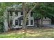 Charming two-story home with a large, well-maintained front yard and attached two car garage at 772 Brookwood Sw Ter, Lilburn, GA 30047