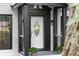 Close up of the home's front entrance, featuring black accents and meticulous landscaping at 772 Brookwood Sw Ter, Lilburn, GA 30047