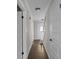 Hallway with hardwood floors and white trim at 772 Brookwood Sw Ter, Lilburn, GA 30047