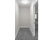 Hallway with carpet leading to a room with natural light at 772 Brookwood Sw Ter, Lilburn, GA 30047