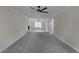 Spacious living room featuring a fireplace, ceiling fans, and natural light at 772 Brookwood Sw Ter, Lilburn, GA 30047